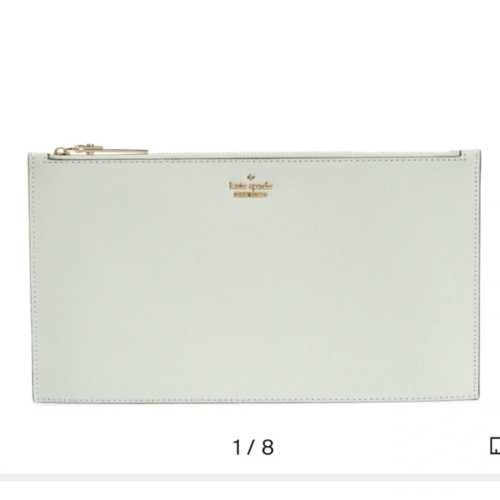kate spade mint green wristlet clutch with gold logo